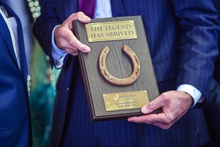 Gary Carano, executive chairman of the board of directors for Caesars Entertainment, holds a plaque with a horseshoe presented by Jack Binion during the grand opening of the rebranded Horseshoe Las Vegas, formerly Ballys Las Vegas, Friday, March 24, 2023.