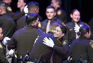 New Metro Police officers celebrate during a graduation ceremony for Metro Police recruits at the Orleans Showroom Tuesday, April 4, 2023. With the graduation Metro Police added 57 new officers.