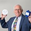 Tim Slifkin, founder and president of Riot Wireless, holds the company’s tank level monitoring sensors. 