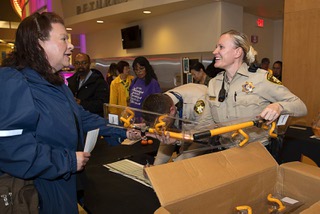 Hyundai and Kia owners pick up steering wheel locks from Metro Police officers after a Metro Police First Tuesday event at the Windmill Library Tuesday, April 4, 2023. Hyundai and Kia have been working with law enforcement agencies to provide more than 26,000 steering wheel locks since November 2022.