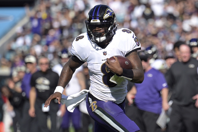 Baltimore Ravens quarterback Lamar Jackson (8) scrambles for yardage during the first half of an NFL football game the Jacksonville Jaguars, Sunday, Nov. 27, 2022, in Jacksonville, Fla. The Ravens agreed in principle with Jackson on a five-year deal Thursday, April 27, 2023, securing their star quarterback for the foreseeable future and ending a contract negotiation saga that was dominating the team's offseason. 


