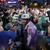 Georgia defensive lineman Jalen Carter, center, celebrates with fans after being chosen by the Philadelphia Eagles with the ninth overall pick during the first round of the NFL football draft, Thursday, April 27, 2023, in Kansas City, Mo.