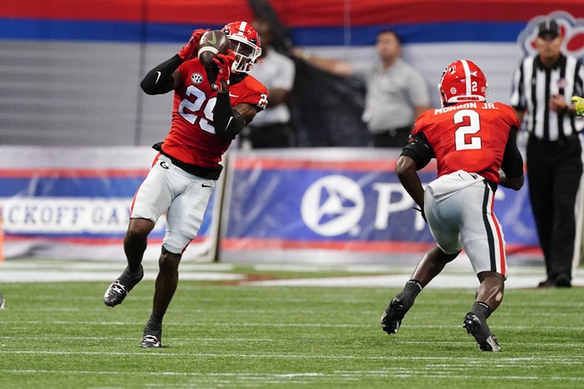 Georgia defensive back Christopher Smith (29) intercepts a pass from Oregon quarterback Bo Nix in the first half of an NCAA college football game Saturday, Sept. 3, 2022, in Atlanta.