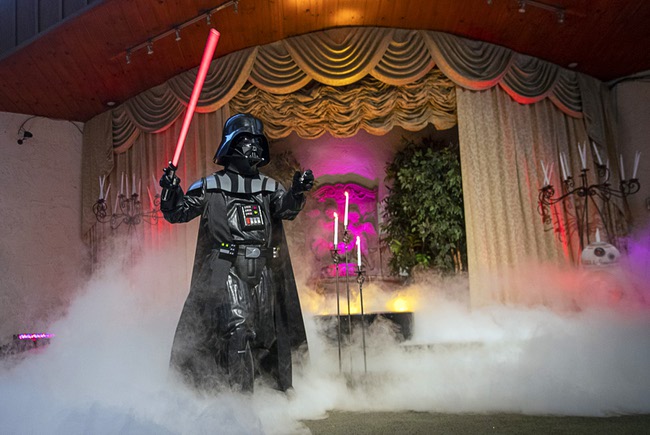 An officiate dressed as Darth Vader performs during a wedding at the Viva Las Vegas Wedding Chapel Thursday, May 4, 2023. Chapels were busy all day with Star Wars-themed weddings as fans came to get married on May the Fourth (May The Force).