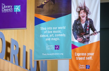 Banners hang from the ceiling in the lobby of the Windmill Library Tuesday, May 16, 2023. Las Vegas-Clark County Library District’s new marketing campaign utilizes updated signage to advertise the Library&nbsp;resources.