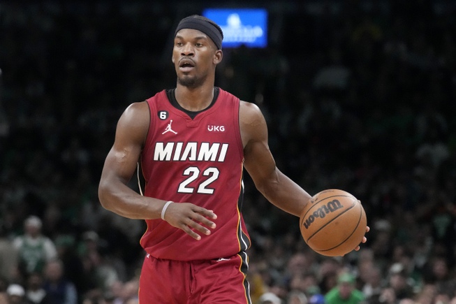 Miami Heat forward Jimmy Butler (22) brings the ball upcourt against the Boston Celtics during the first half of Game 2 of the NBA basketball playoffs Eastern Conference finals in Boston, Friday, May 19, 2023. 


