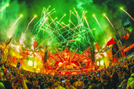 Fireworks light the sky over the Kinetic Field stage overnight May 22, 2023, on the first day of the Electric Daisy Carnival at the Las Vegas&nbsp;Speedway.