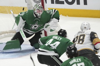 Vegas Golden Knights left wing William Carrier (28) scores a goal against Dallas Stars goaltender Jake Oettinger (29) and defenseman Joel Hanley (44) during the first period of Game 3 of the NHL hockey Stanley Cup Western Conference finals in Dallas, Tuesday, May 23, 2023. 


