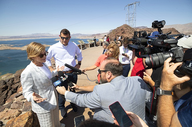 Congresswoman Susie Lee, left, D-Nev., and Congressman David Valadao, R-Calif., answer questions from reporters during a tour and discussion at the Lakeview Overlook at Lake Mead Friday, May 26, 2023. The stop at the overlook was part of a tour of Southern Nevada and a bipartisan exchange between the Representatives' Nevada and California districts.