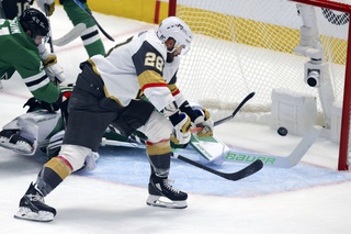 Vegas Golden Knights left wing William Carrier (28) scores past Dallas Stars goalie Jake Oettinger, back, during the first period of Game 6 of the NHL hockey Stanley Cup Western Conference finals Monday, May 29, 2023, in Dallas.