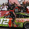 Ryan Blaney (12) climbs out of his car in Victory Lane after winning a NASCAR Cup Series auto race at Charlotte Motor Speedway, Monday, May 29, 2023, in Concord, N.C.