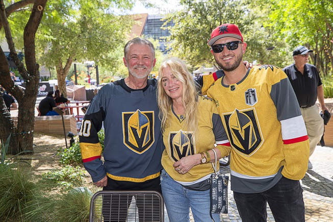 Ron Portaro, his wife Lynne and son Christian pose in The Park before Game 1 of the Stanley Cup Final between the Vegas Golden Kinights and the Florida Panthers at T-Mobile Arena Saturday, June 3, 2023. Ron Portaro is wearing a customized Golden Knights jersey made to commemorate the Oct. 1 mass shooting.