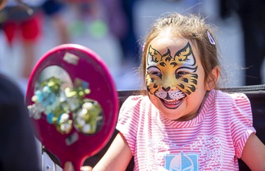 Aria J., 4, looks at a mirror after getting her face painted in Toshiba Plaza before Game 5 of the Stanley Cup Final at T-Mobile Arena Tuesday, June 13, 2023, in Las Vegas.