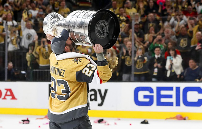Vegas Golden Knights defenseman Alec Martinez (23) kisses the Stanley Cup Trophy after the Vegas Golden Knights beat the Florida Panthers 9-3 in Game 5 to win the Stanley Cup Final at T-Mobile Arena Tuesday, June 13, 2023, in Las Vegas.