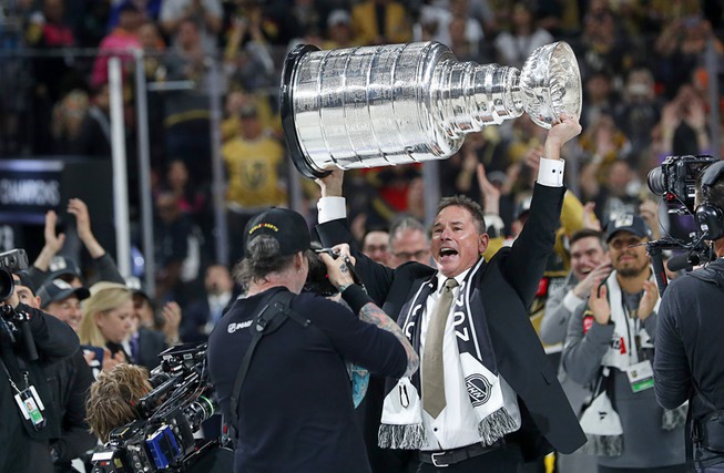 Vegas Golden Knights head coach Bruce Cassidy holds up the Stanley Cup Trophy after the Vegas Golden Knights beat the Florida Panthers 9-3 in Game 5 to win the Stanley Cup Final at T-Mobile Arena Tuesday, June 13, 2023, in Las Vegas.