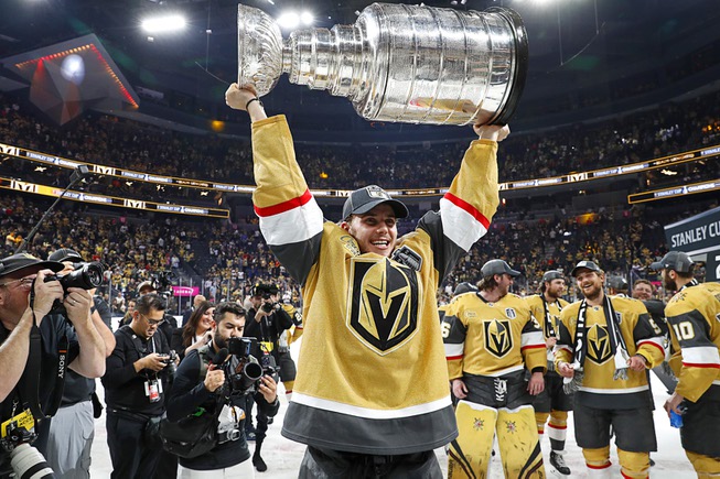 Vegas Golden Knights center Brett Howden (21) poses with the Stanley Cup after the Golden Knights beat the Florida Panthers 9-3 in Game 5 to win the Stanley Cup Final at T-Mobile Arena Tuesday, June 13, 2023, in Las Vegas.