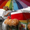 Street vendor Luis Sanchez waits for customers by his mobile food stand in a residential neighborhood  in North Las Vegas Wednesday, June 14, 2023. Senate Bill 92, signed by Governor Joe Lombardo, when fully implemented, will legitimize street vendors across the state, providing them with the necessary permits to operate and grow their small businesses. A town hall session held by Make the Road Nevada and the Nevada Immigrant Coalition laid out what the expectations should be for vendors and law enforcement until the relevant laws take effect by July 1, 2024.