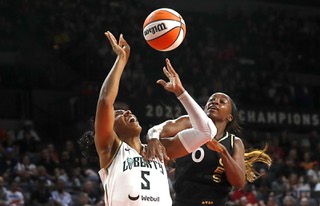 New York Liberty forward Kayla Thornton (5) is fouled by Las Vegas Aces guard Jackie Young (0) during the first half of a WNBA basketball game at the Michelob Ultra Arena at Mandalay Bay Thursday, June 29, 2023.