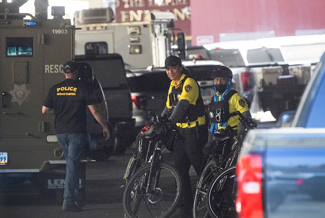 Cesars Palace bicycle security officers are shown near a Metro Police SWAT vehicle at the Caesars Palace delivery dock Tuesday, July 11, 2023. Metro Police were called after a man apparently forced a woman into a hotel room and barricaded himself inside.
