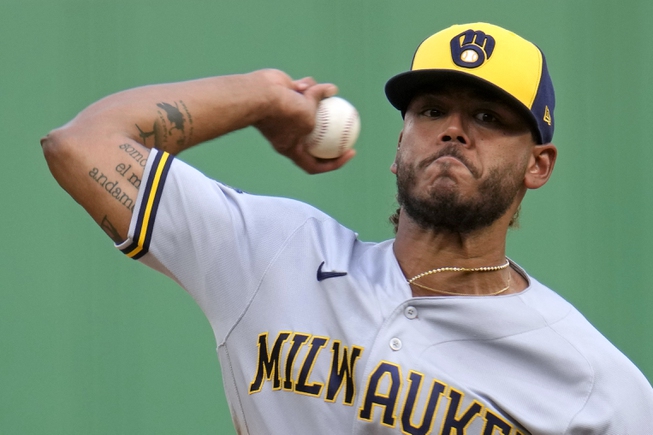 Milwaukee Brewers starting pitcher Freddy Peralta delivers during the first inning of a baseball game against the Pittsburgh Pirates in Pittsburgh, Friday, June 30, 2023.