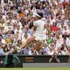 Tunisia's Ons Jabeur kicks the ball after failing to chase down a volley by Aryna Sabalenka of Belarus in their women's singles semifinal match on day eleven of the Wimbledon tennis championships in London, Thursday, July 13, 2023.