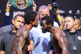 WBC/WBA/IBF welterweight champion Errol Spence Jr., left, speaks to WBO champion Terence Crawford as they face off during an official weigh-in at T-Mobile Arena Friday, July 28, 2023. The undefeated champions are scheduled for a unification title fight at the arena Saturday.