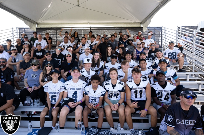 The Spring Valley High football team poses while watching a Raiders' training-camp practice on Sunday July 30 in Henderson.