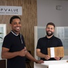 Owner Brooks Smith, left, and Nico Fenske, general manager, pose in the lobby at ChopValue Las Vegas Wednesday, Aug. 16, 2023. The company recycles used chopsticks from restaurants and turns them into a variety of products.
