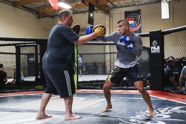 Coach Jimmy Gifford, left, trains UFC fighter Natan Levy at Xtreme Couture MMA Monday, Aug. 21, 2023.