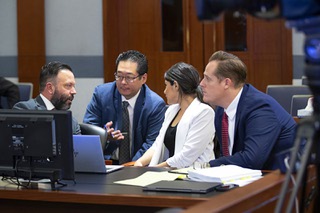 Ethan Thomas, left, attorney for the Clark County School District, talks with his team during a break in a hearing at the Regional Justice Center Tuesday, Aug. 22, 2023. District Court Judge Jessica Peterson denied a request by the Clark County School District to issue a teacher strike injunction against he Clark County Education Association (CCEA).