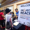 People check in at a registration desk during a Project Reach Senior Expo at Sams Town Thursday, Aug. 24, 2023. The expos, a partnership of United Way of Southern Nevada and the NV Energy Foundation, provide assistance with utilities for low-income people age 62 or older.