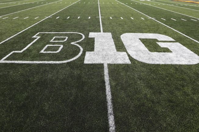 The Big Ten logo is displayed on the field before an NCAA college football game between Iowa and Miami of Ohio in Iowa City, Iowa., Aug. 31, 2019. Dealing a crushing combination to the Pac-12 on Friday, Aug. 4, 2023, the Big Ten announced Oregon and Washington would be joining the conference next August, and the Big 12 completed its raid of the beleaguered league by adding Arizona, Arizona State and Utah. 


