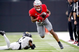 UNLV Rebels wide receiver Dominic Gicinto (17) avoids a tackle by Bryant University Bulldogs defensive back Robert Crockett III (17) during the second half of the Rebels season opener at Allegiant Stadium Saturday, Sept. 2, 2023.