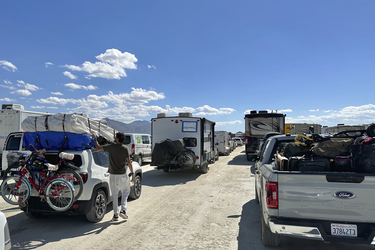 Wait times to exit Burning Man drop after flooding left tens of thousands  stranded in Nevada desert