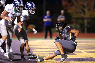 Faith Lutheran running back Sean Sampson (4) makes it through the Green Valley defense and falls in the end zone for a touchdown during the first half of a high school football game at Faith Lutheran High School Friday, Sept. 8, 2023.