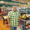 Derrick Taylor, owner of Shall We Play? Games and More Store, poses for a photo in his shop Thursday, Aug. 23, 2023.  