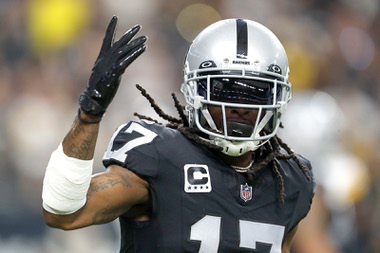 Las Vegas Raiders wide receiver Davante Adams (17) gestures to fans after scoring a touchdown against the Pittsburgh Steelers during the first half of an NFL football game at Allegiant Stadium Sunday, Sept. 24, 2023.