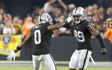 Las Vegas Raiders cornerback Jakorian Bennett (0) and cornerback Nate Hobbs (39) celebrate a defensive play during the second half of an NFL football game against the Pittsburgh Steelers at Allegiant Stadium Sunday, Sept. 24, 2023.