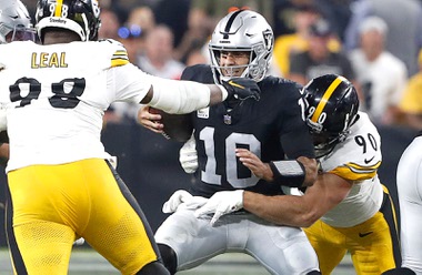 Las Vegas Raiders quarterback Jimmy Garoppolo (10) is sacked late in the second quarter by Pittsburgh Steelers linebacker T.J. Watt (90) defensive end DeMarvin Leal (98) during the first half of an NFL football game at Allegiant Stadium Sunday, Sept. 24, 2023.