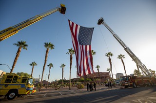 Family and friends of victims and survivors of the Route 91 Harvest Festival shooting gather alongside members of law enforcement and first responder during the annual 1 October Sunrise Remembrance Ceremony at the Clark County Government Center amphitheater Sunday, Oct. 1, 2023.