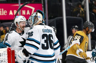 San Jose Sharks defenseman Kyle Burroughs (4) celebrates with goaltender Kaapo Kahkonen (36) as Vegas Golden Knights right wing Keegan Kolesar (55) skates away after the Sharks shut out the Golden Knights 2-0 in an NHL preseason hockey game at T-Mobile Arena Tuesday, Oct. 3, 2023.