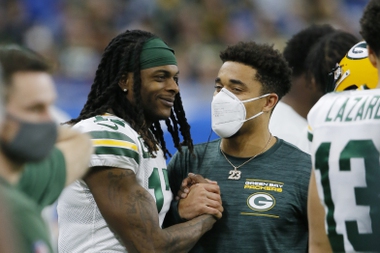 Green Bay Packers wide receiver Davante Adams talks to Jaire Alexander during the second half of an NFL football game against the Detroit Lions, Sunday, Jan. 9, 2022, in Detroit.
