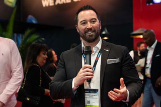 Shawn Fluharty, Head of Government Affairs at Playn Go, speaks at their booth during the G2E media tour at the Venetian Hotel in Las Vegas, Wednesday, October 11, 2023 Brian Ramos.