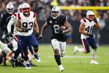 Las Vegas Raiders running back Josh Jacobs (8) runs the ball during the second half of a NFL football game against New England Patriots at Allegiant Stadium Sunday, Oct. 15, 2023.