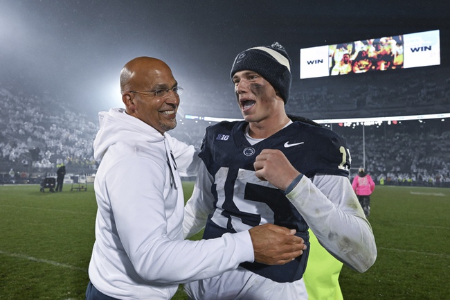 Penn State head coach James Franklin and quarterback Drew Allar (15) celebrate a 31-0 win over Iowa in a NCAA college football game, Saturday, Sept. 23, 2023, in State College, Pa.