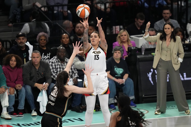 Las Vegas Aces' Cayla George (13) shoots over New York Liberty's Breanna Stewart (30) during the first half in Game 4 of a WNBA Finals Wednesday, Oct. 18, 2023, in New York.


