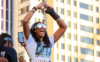Las Vegas Aces forward A'ja Wilson makes a heart symbol to fans as she arrives at Toshiba Plaza for the Las Vegas Aces championship celebration Monday, Oct. 23, 2023. The Aces became back-to-back WNBA national champions after beating the New York Liberty in Game 4 on Wednesday.