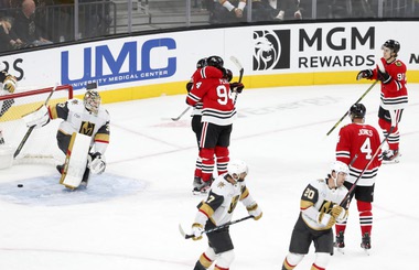 Chicago Blackhawks right wing Corey Perry (94) celebrates with center Philipp Kurashev after Kurashev scored past Vegas Golden Knights goaltender Adin Hill (33) in overtime of an NHL hockey game at T-Mobile Arena Friday, Oct. 27, 2023. The Blackhawks defeated the Vegas Golden Knights 4-3. 