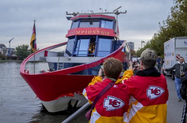 Two women from Kansas City take pictures of a ship that docked in Frankfurt, Germany, Wednesday, Nov. 1, 2023. The Miami Dolphins are set to play the Kansas City Chiefs in an NFL game in Frankfurt on Sunday Nov. 5. The ship was chartered by the chiefs.