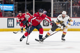 Washington Capitals center Connor McMichael (24) and Vegas Golden Knights right wing Michael Amadio battle for control of the puck in the first period Tuesday, Nov. 14, 2023, in Washington. 


